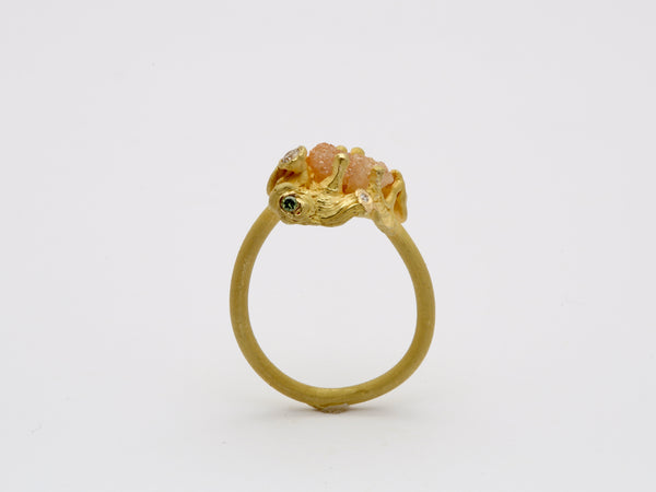 18k gold ring with raw diamond.