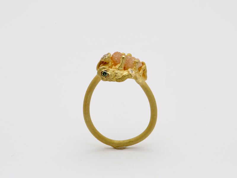 18k gold ring with raw diamond.