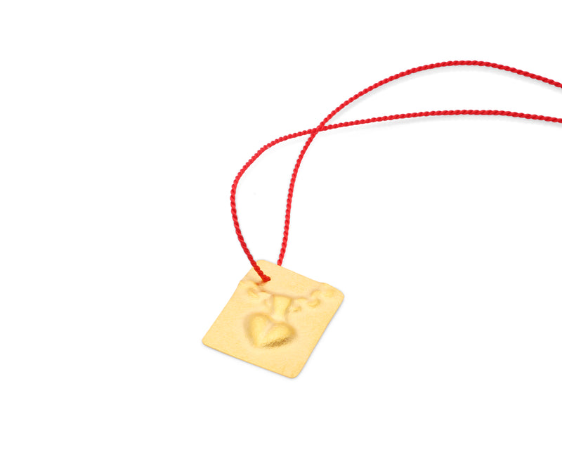 Guldgubber Fine gold pendant with heart imprint and red silk cord